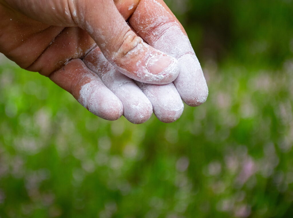 fine chalk in somebody's finger-tips