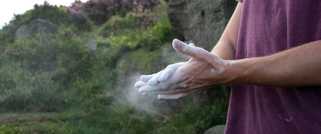 Climber using our sustainable chalk in the Peak District