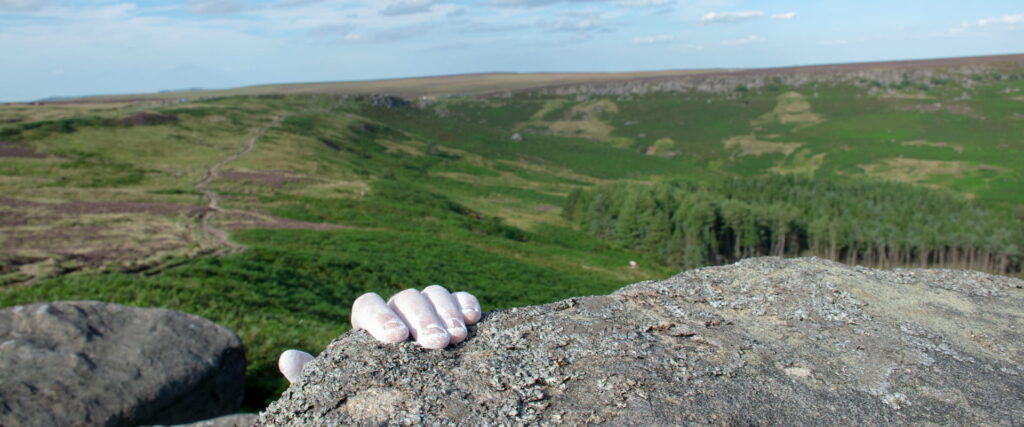 Climbers hand in the Peak District climbing using our chalk