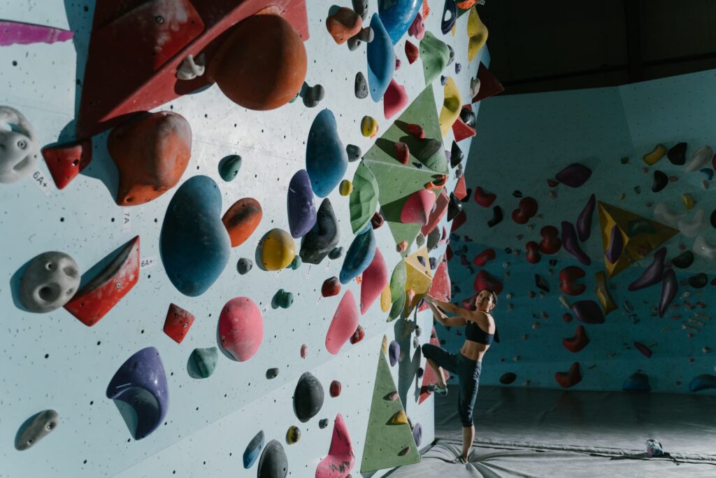 improve grip by regularly climbing at your local bouldering wall.