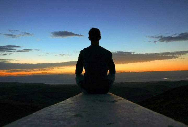 climber in meditation after a day of climbing.