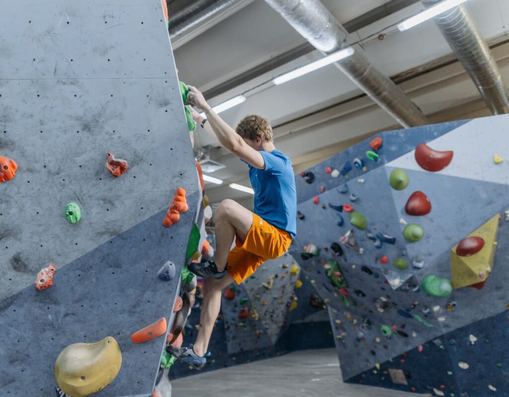 climber bouldering demonstrating dangers of injuries